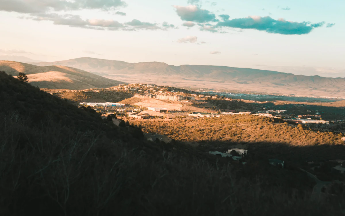 View across the Prescott area toward distant mountains, with homes in the valley